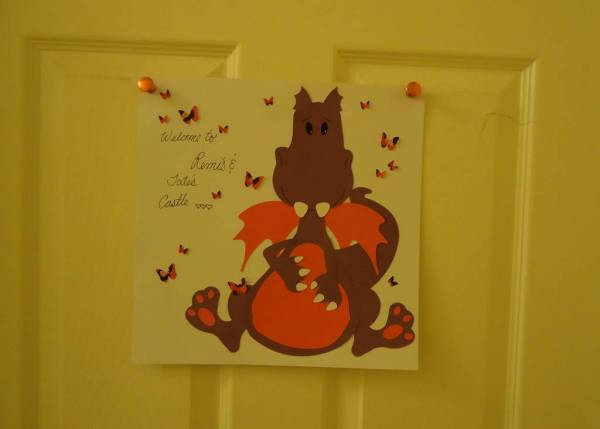 Darcy the Dragon as a Door Sign