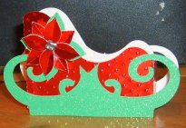 sleigh box and poinsettia decoration