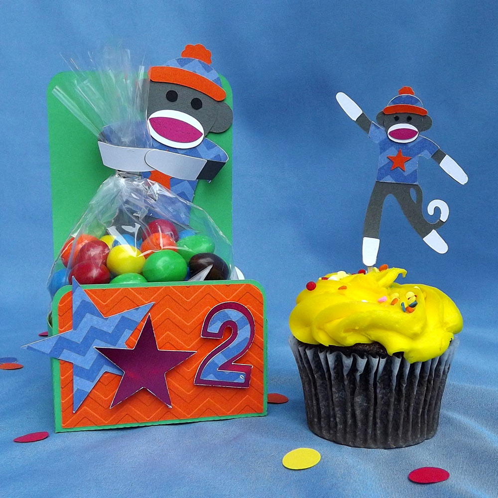 Monkey themed birthday party with toy monkey cutting files