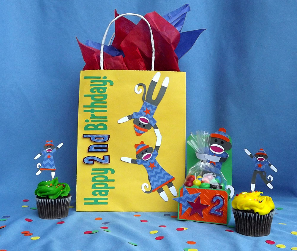 Monkey themed birthday party set with toy monkey cutting files.