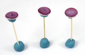 Stand toothpicks upright in more poster putty to dry