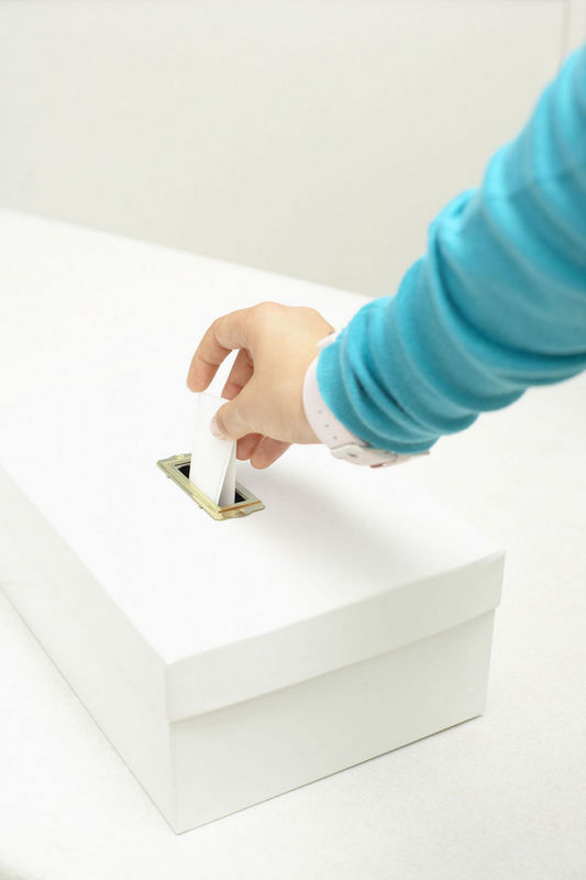 Woman Voting Ballot Box