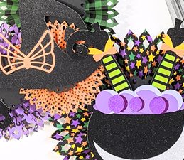 Pazzles DIY Halloween Rosette Hanging Decor with instant SVG download. Compatible with all major electronic cutters including Pazzles Inspiration, Cricut, and Silhouette Cameo. Design by Monica Martinez.