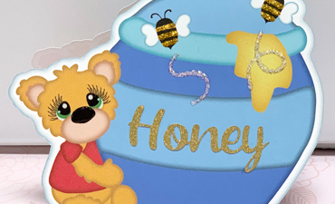 Pazzles DIY Honey Bear Card with instant SVG download. Compatible with all major electronic cutters including Pazzles Inspiration, Cricut, and Silhouette Cameo. Design by Lisa Reyna.