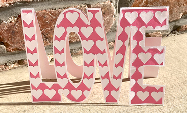 Pazzles DIY Love Word Card with instant SVG download. Compatible with all major electronic cutters including Pazzles Inspiration, Cricut, and SIlhouette Cameo. Design by Sara Weber.