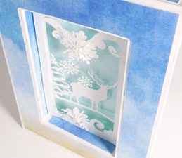 Pazzles DIY Winter Shadow Box Card or Frame with instant SVG download. Compatible with all major electronic cutters including Pazzles Inspiration, Cricut, and Silhouette Cameo. Design by Julie Flanagan.