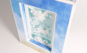 Pazzles DIY Winter Shadow Box Card or Frame with instant SVG download. Compatible with all major electronic cutters including Pazzles Inspiration, Cricut, and Silhouette Cameo. Design by Julie Flanagan.